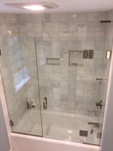 Custom Tub Enclosure With 2 Fixed Panels And Door Hinged Off Panel